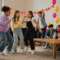 kids dancing and playing games in a house